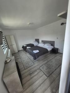 Un pat sau paturi într-o cameră la Casa Marm