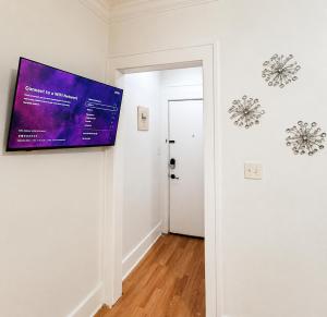 a white room with a painting on the wall at Convention District Studio - Downtown Houston in Houston