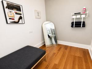 a room with a bed and a mirror at Convention District Studio - Downtown Houston in Houston
