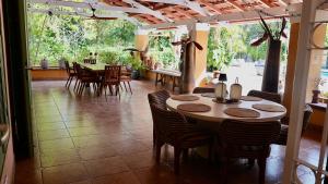 a dining room with a table and chairs at Coconuts Tropical Boutique Hotel Curaçao in Willemstad