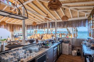 a bar with a view of the ocean at Ondo Beach & Suites in Bodrum City