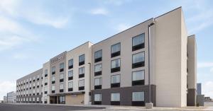 an office building with a sign on the side of it at StudioRes by Marriott Clearfield Layton in Clearfield