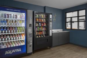 a soda machine in a store with soda drinks at StudioRes by Marriott Clearfield Layton in Clearfield