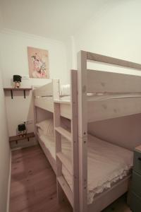 a couple of bunk beds in a room at Appartement Promenadenhirsch in Bad Gastein