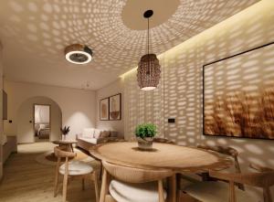 a living room with a table and a couch at Theo's Garden Villa in Kefalos