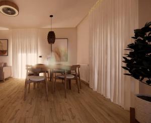a dining room with a table and chairs at Theo's Garden Villa in Kefalos
