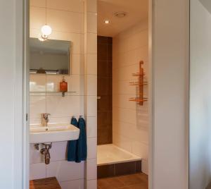 a bathroom with a sink and a bath tub at Droom op de Vijlenberg in Vijlen +38 photos