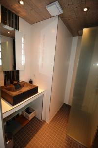 a bathroom with a sink and a mirror at RESIDENCE LE PACHA Courchevel 1850 in Courchevel