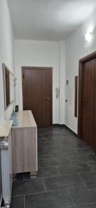 a room with a desk and a hallway with a door at Arenzano rooms in Arenzano