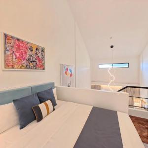a bedroom with a large bed in a room at Raffy White Boracay in Boracay