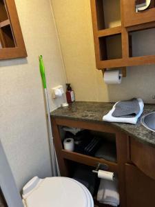 a small bathroom with a toilet and a sink at The Boardwalk in Westfield Beach