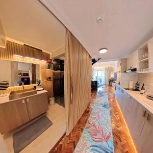 a large kitchen with a large rug on the floor at Raffy White Boracay in Boracay