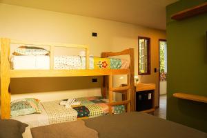 a bedroom with two bunk beds in a room at Hotel Pousada Flor de Alecrim - Goiana in Goiana +72 photos