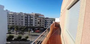 a balcony of a building with a view of a street at Apartamento dina 13 in Fnidek