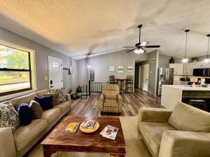 a living room with a couch and a table at Pine Bluff on the Lake in Golden
