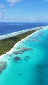 an aerial view of an island in the ocean at Tranquil Retreat Dhigurah in Dhigurah