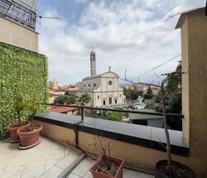 a view of a church from the balcony of a building at Paco Apartment Center Shkoder in Shkodër
