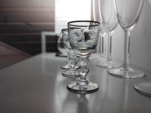 a group of wine glasses sitting on a table at Heritage House at Villa Sofia in Lahti +52 photos