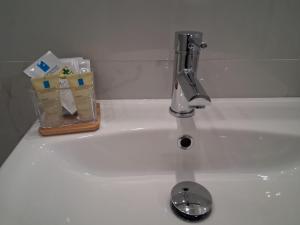 a bathroom sink with a faucet and a drain at B&B Colle Degli Angeli in Penne +32 photos