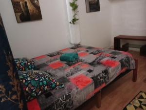 a bed with a quilt on it in a room at villa des Filaos et du lagon 0693-70'59'79 in Saint-Leu +52 photos