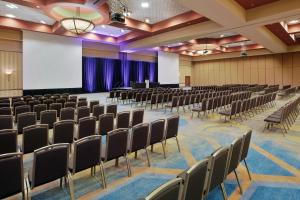 an empty lecture hall with chairs and a projection screen at Embassy Suites Murfreesboro - Hotel & Conference Center in Murfreesboro +47 photos