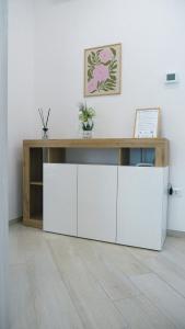 a desk in a room with a white wall at MESSAPIA HOME Apartments in Mesagne
