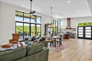 a living room with a couch and a table at Cambridge Cabin in Stanton