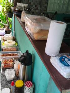 a counter with some food on a table at Pousada Suíte Conexao in Conceição da Barra +47 photos