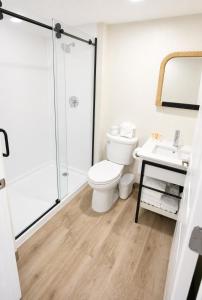 a bathroom with a toilet and a sink at Palm & Tide Beachfront Hotel in Panama City Beach