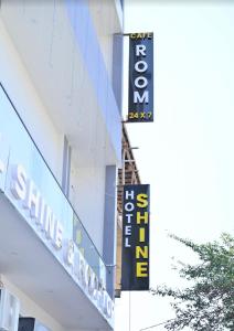 a sign on the side of a building at Hotel shine plus in Kurukshetra