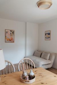 a living room with a table and a couch at "LOKAL" Apartment 2 in Bad Muskau