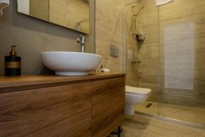 a bathroom with a sink and a toilet and a shower at Ondo Beach & Suites in Bodrum City