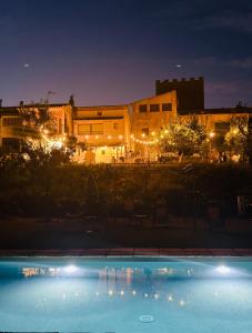 a swimming pool in front of a building at night at Castillo de Bulbuente de Luis Zueco in Bulbuente