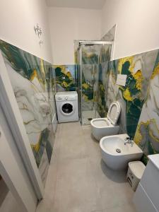a bathroom with a toilet and a sink and a shower at Angelo in Futani