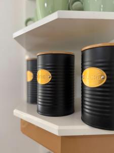 three rolls of black electrical wires on a shelf at Edenbluetropical in Le Moule