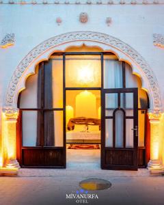 an open door to a bedroom in a building at MivanUrfa Otel in Urfa