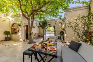 a table with a plate of food on it at Arcus Cappadocia in Göreme