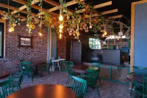 a room with tables and chairs and a brick wall at KILIÇ MOTEL in Istanbul