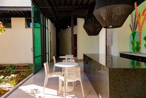 a table and chairs sitting on a patio at Hm Express in Colima