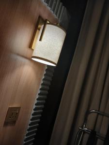 a light on a stairway in a room at فندق لوكس جراند in Dubai
