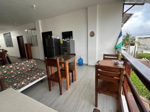 a living room with a table and chairs and a couch at Galápagos Downtown Suite in Puerto Ayora