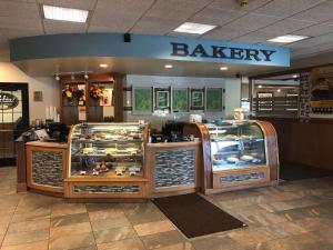 a bakery with a display case in a store at Best Western Tomah Hotel in Tomah