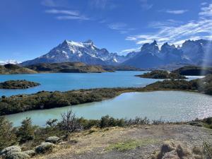 a view of a lake with mountains in the background at Cabaña Julián Elias Verde in Puerto Natales