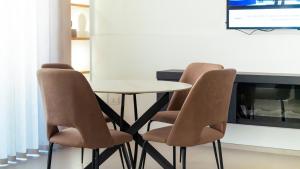 a table and four chairs in a room at Tradomari in Mesagne