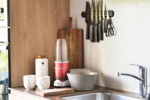 a kitchen counter with a mixer and a sink at Interior designers second home FREE BIKES in Tulum