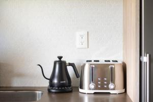 a coffee maker and a toaster on a kitchen counter at Interior designers second home FREE BIKES in Tulum