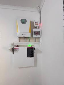 a machine is hanging on a wall at The Tiny House - Solwezi in Solwezi +2 photos