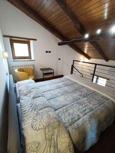 a bedroom with a large bed in a room at Capocampo Amalfi Coast in Tramonti