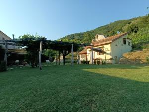 a large yard with a building and a house at Capocampo Amalfi Coast in Tramonti