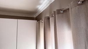 a room with white curtains and a ceiling at SAOB Property- South A in Germiston